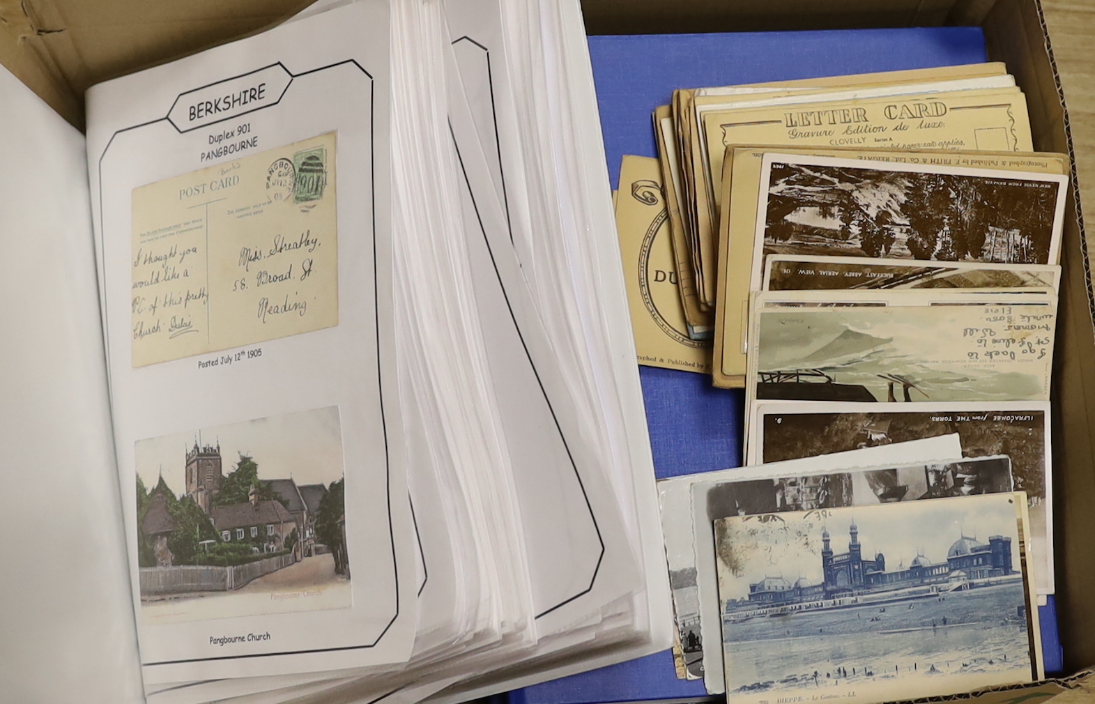 Four postcard albums, some loose, mostly topographical; towns and people